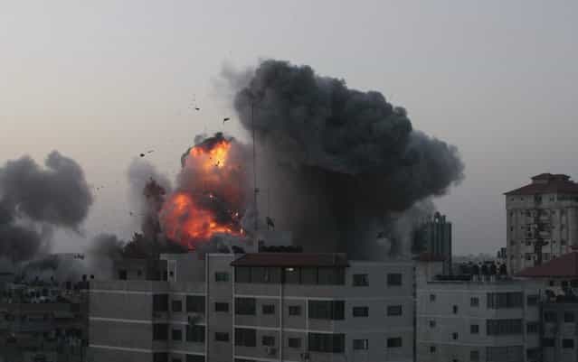 An explosion and smoke are seen after Israeli strikes in Gaza City November 18, 2012. Israel bombed militant targets in Gaza for a fifth straight day on Sunday, launching aerial and naval attacks as its military prepared for a possible ground invasion, though Egypt saw [some indications] of a truce ahead. (Photo by Ahmed Zakot/Reuters)