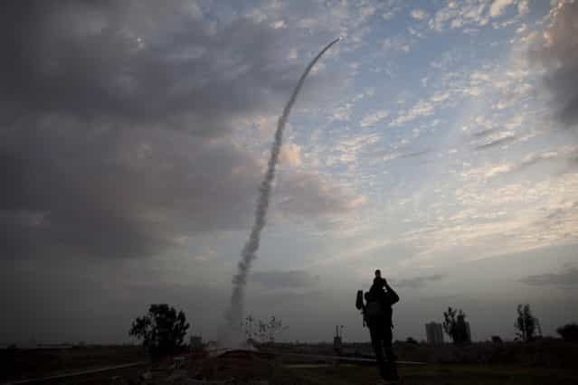 An Iron Dome missile is launched in Tel Aviv, to intercept a rocket fired from Gaza, Saturday, Nov. 17, 2012. Israel bombarded the Hamas-ruled Gaza Strip with nearly 200 airstrikes early Saturday, the military said, widening a blistering assault on Gaza rocket operations to include the prime minister's headquarters, a police compound and a vast network of smuggling tunnels. (Photo by Oded Balilty/AP Photo)