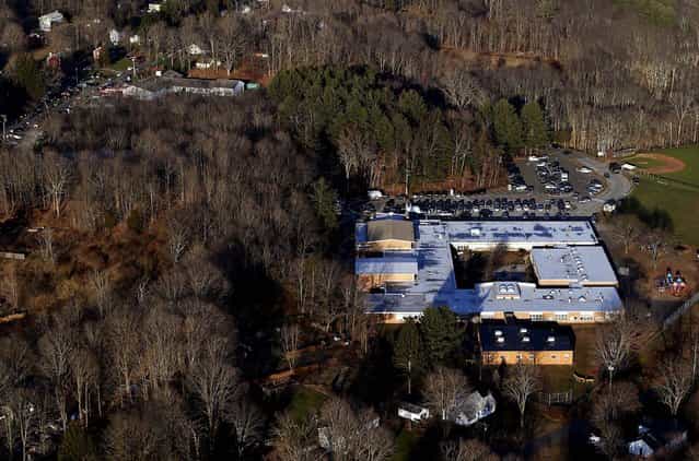 The school in Newtown is surrounded by woods. (Photo by Julio Cortez/Associated Press)