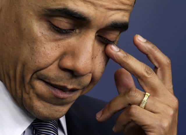 U.S. President Barack Obama wipes a tear as he speaks about the shooting at Sandy Hook Elementary School in Newtown, Conn., during a press briefing in Washington D.C., December 14, 2012. (Photo by Yuri Gripas/Reuters)