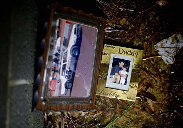Family photos remain inside a tornado shelter where residents ran from their homes to take cover from the tornado in Adairsville. (Photo by David Goldman/Associated Press)