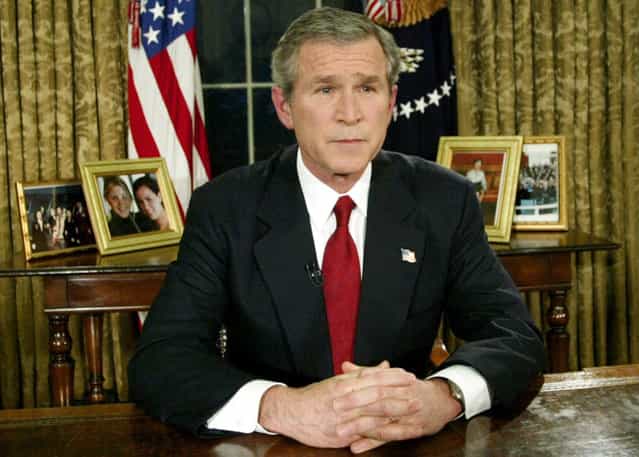 U.S. President George W. Bush announced the start of war between the United States and Iraq during a televised address from the Oval Office, on March 19, 2003. The United States said it had began its war against Iraq just minutes after several explosions were heard over Baghdad. (Photo by Kevin Lamarque/Reuters/The Atlantic)