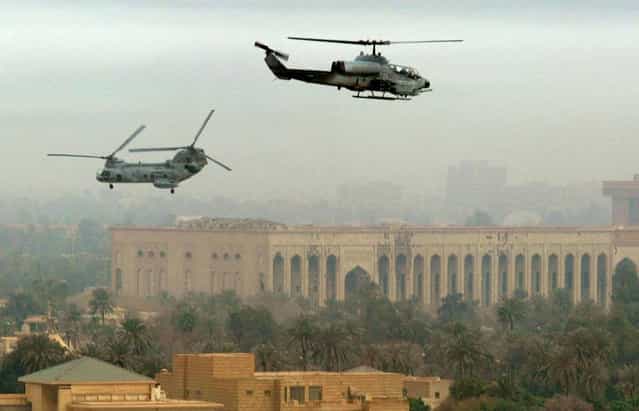 U.S. Marine helicopters patrol the skies over Baghdad, on April 13, 2003. (Photo by Gleb Garanich/Reuters/The Atlantic)