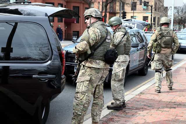 State police guard an area near Kenmore Square after two bombs exploded during the 117th Boston Marathon on April 15, 2013 in Boston, Massachusetts. (Photo by Alex Trautwigs)
