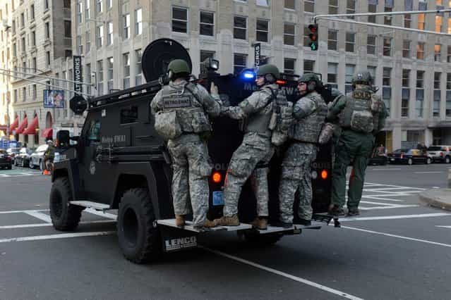 A swat team arrives at the corner of Stuart Street and Dartmouth Street after two explosive devices detonated at the finish line of the 117th Boston Marathon on April 15, 2013 in Boston, Massachusetts. (Photo by Darren McCollester)