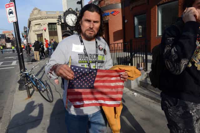 Carlos Arredondo, who was at the finish line of the 117th Boston Marathon when two explosives detonated, leaves the scene on April 15, 2013 in Boston, Massachusetts. (Photo by Darren McCollester)
