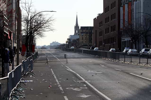 Beacon Street near Kenmore Square remains empty for the use of emergency vehicles after two explosive devices detonated at the finish line of the 117th Boston Marathon on April 15, 2013 in Boston, Massachusetts. (Photo by Alex Trautwig)