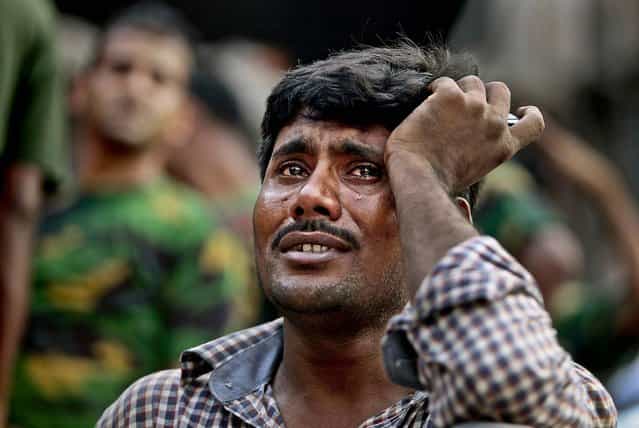 A relative of a victim cries at the scene. (Photo by A. M. Ahad/Associated Press)
