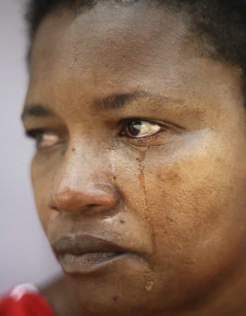 Brazilian woman Ana Claudia, who witnessed her son Reinaldo being beaten and shot dead by drug traffickers, cries during an interview in the Fazendo Couto slum of Salvador, Bahia State, April 11, 2013. One of Brazil's main tourist destinations and a 2014 World Cup host city, Salvador suffers from an unprecedented wave of violence with an increase of over 250% in the murder rate, according to the Brazilian Center for Latin American Studies (CEBELA). (Photo by Lunae Parracho/Reuters)