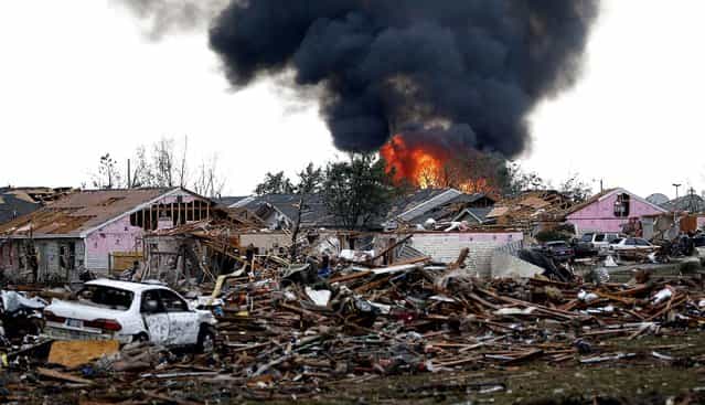 A fire burns in the Tower Plaza Addition in Moore. (Photo by Sue Ogrocki/Associated Press)