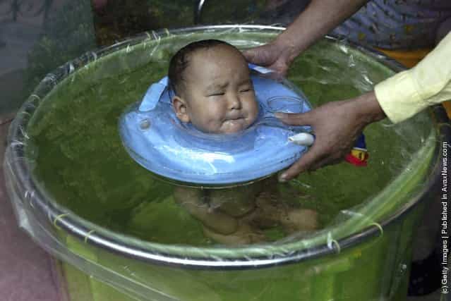 A Chinese baby swims at a nursery in Shanghai