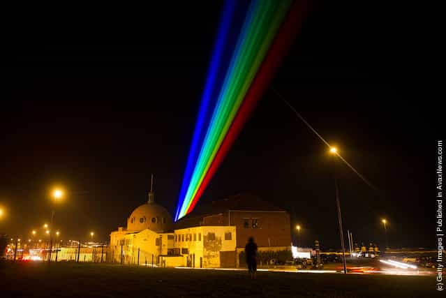 International artist Yvette Mattern shows her stunning laser rainbow projection, Global Rainbow
