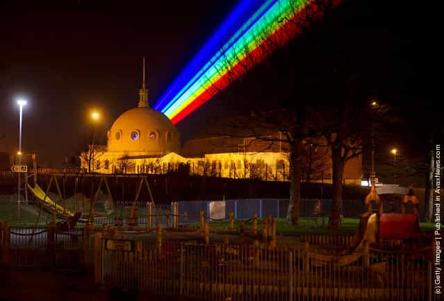 International artist Yvette Mattern shows her stunning laser rainbow projection, Global Rainbow
