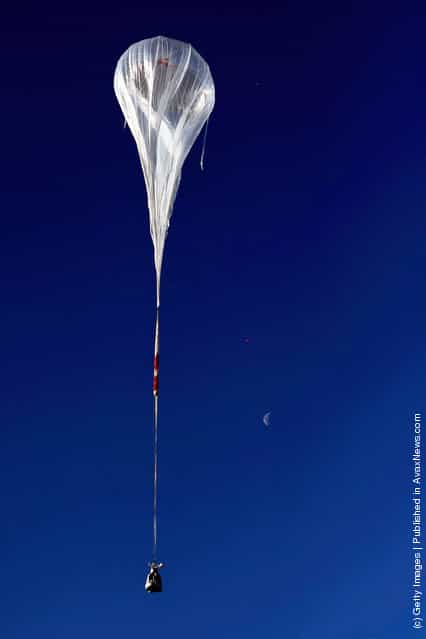 The balloon ascends during the first manned test flight for Red Bull Stratos
