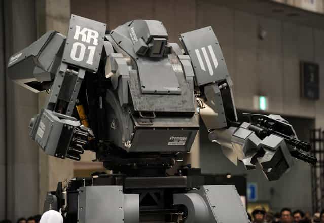 Japanese electronics company Suidobashi Heavy Industry unveils its latest robot [Kuratas] at the Wonder Festival in Chiba, suburban Tokyo on July 29, 2012. The Kuratas robot, which will go on sale with a price tag of one million USD, measures four meters in height, weighs four tons and has four wheeled legs that can either be controlled remotely through the 3G network or by a human seated within the cockpit.
