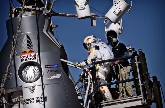 Baumgartner steps into the capsule. (Photo by Balazs Gardi/Red Bull Stratos)