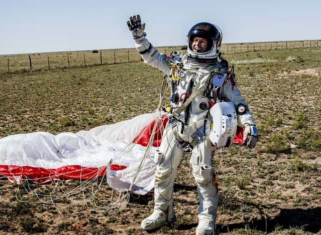Baumgartner celebrates after successfully completing the jump. (Photo by Balazs Gardi/Red Bull Stratos)