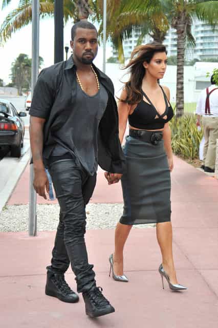 Sunday October 14, 2012. Kim Kardashian looks to have left her underwear at home as she heads out for an early dinner with boyfriend Kanye West in Miami. As Kim checked out her outfit in the reflection of her car, it became apparent that the reality star was not wearing any underwear as she showed off her see-through grey skirt. (Photo by Brett Kaffee/Thibault Monnier/PacificCoastNews.com)