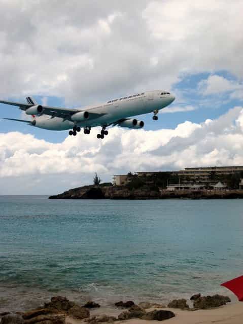 [Air Fraance in St. Maarten. The landing pattern at SXM (St. Maarten) takes planes in low over Maho Beach, making shots like these as easy as pointing the camera in the direction of the engine roar]. (Photo by David Gilford)