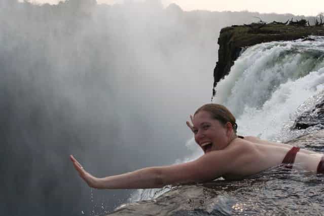 Angela would like to jump... don't leave me honey! Devil's Pool, Victoria Falls. (Photo by Fritz Stugren)