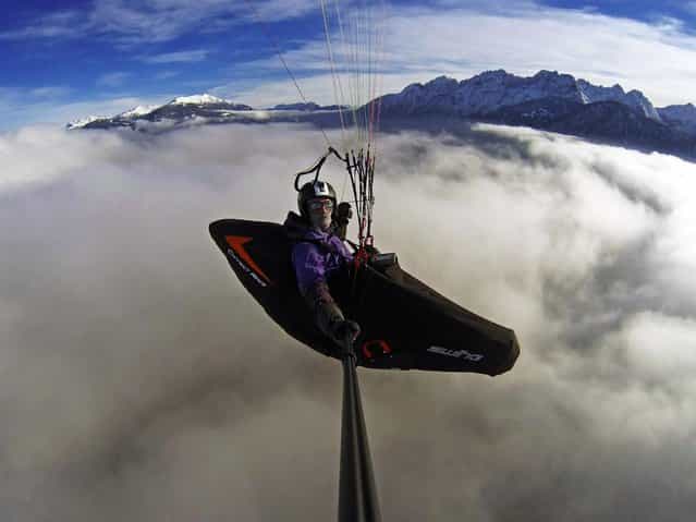 [Paragliding Thermik.net Cloudbusters by Daniel Kofler. Awesome flight over the clouds towards the Dolomites of Lienz in Tirol/Austria. Shot with the GoPro HERO3 Black Edition]. (Photo by Daniel Kofler)