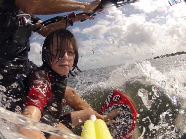 [Lonny & Dylan by Patrick Rynne. As if kiting on a skimboard isn't hard enough, try doing it with a GoPro in one hand and your nephew holding onto your legs! Lonny & Dylan Morris tandem #waterlusting in Miami. Video coming soon!]. (Photo by Patrick Rynne)