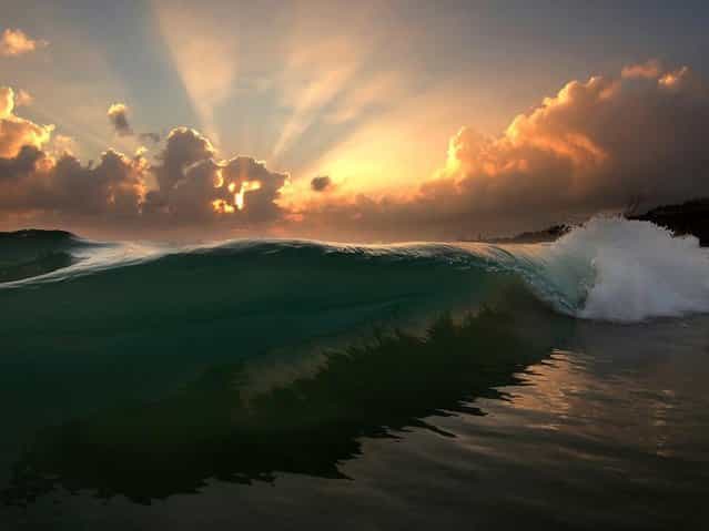 [North Shore Sunrise by Freddy Booth. Can't remember the last time i woke up early to surf, but lately photography has got me dawn patrolling again. My first Love, and life itself, The Ocean... Mahalo Ke Akua!]. (Photo by Freddy Booth)