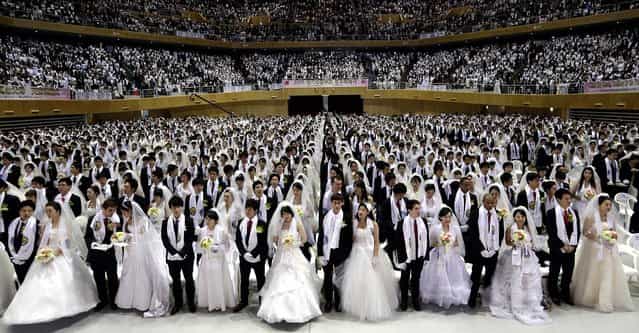 Couples from around the world participate in a mass wedding ceremony at the CheongShim Peace World Center in Gapyeong, South Korea. (Photo by Lee Jin-man/Associated Press)