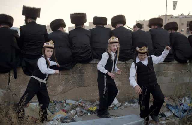 Ultra-Orthodox Jews of the Belz Hasidic Dynasty attend the wedding ceremony of Rabbi Shalom Rokach, the Grandson of the Belz Rabbi to Hana Batya Pener, in Jerusalem on May 21, 2013. Some 25,000 Ultra-Orthodox Jews participated in one of the biggest weddings in the past few years. (Photo by Menahem Kahana/AFP Photo)