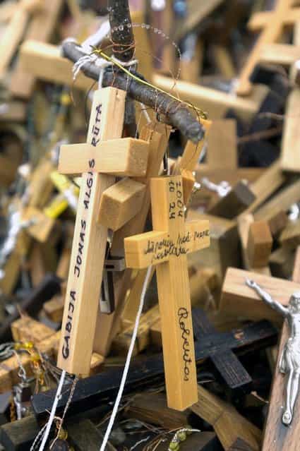 Some leave messages to God along with a cross. (Photo by Richard Gardner/Rex USA)