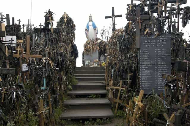 KGB agents were stationed at the site when crosses continued to appear. (Photo by Richard Gardner/Rex USA)