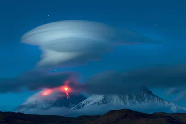 Lenticular clouds over the mountains of the Kamchatka Peninsula in Russia. (Photo by Denis Budkov/Caters News)