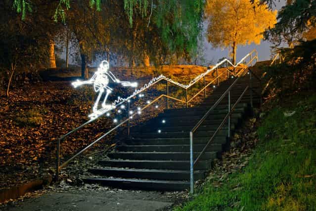 A light skateboarder grinding a rail. (Photo by Darren Pearson/Caters News)