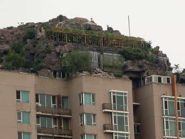 Rock Villa on Top of Apartment Tower in China