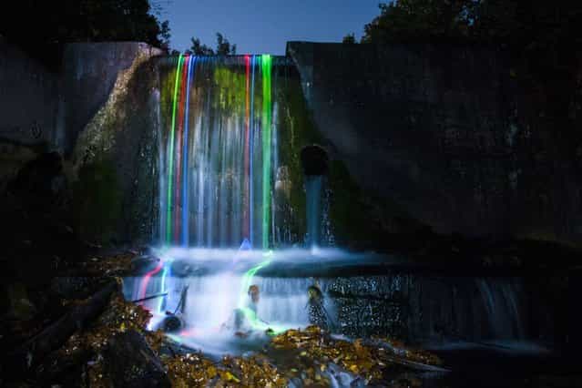 The otherworldy images are created by clever use of long exposure photography and glow sticks floating through water. (Photo by Sean Lenz/Kristoffer Abildgaard)